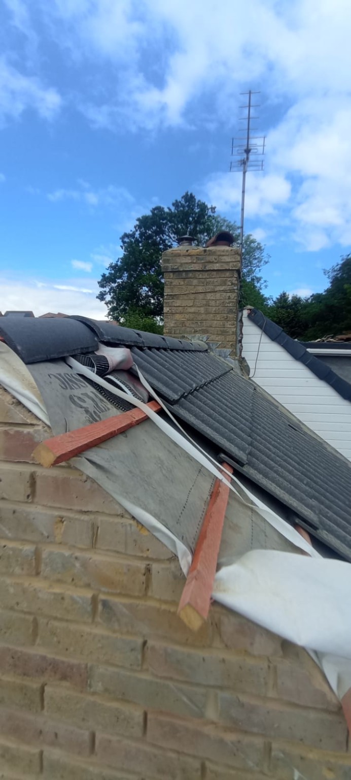 Roof work next to a chimney stack in Tadley