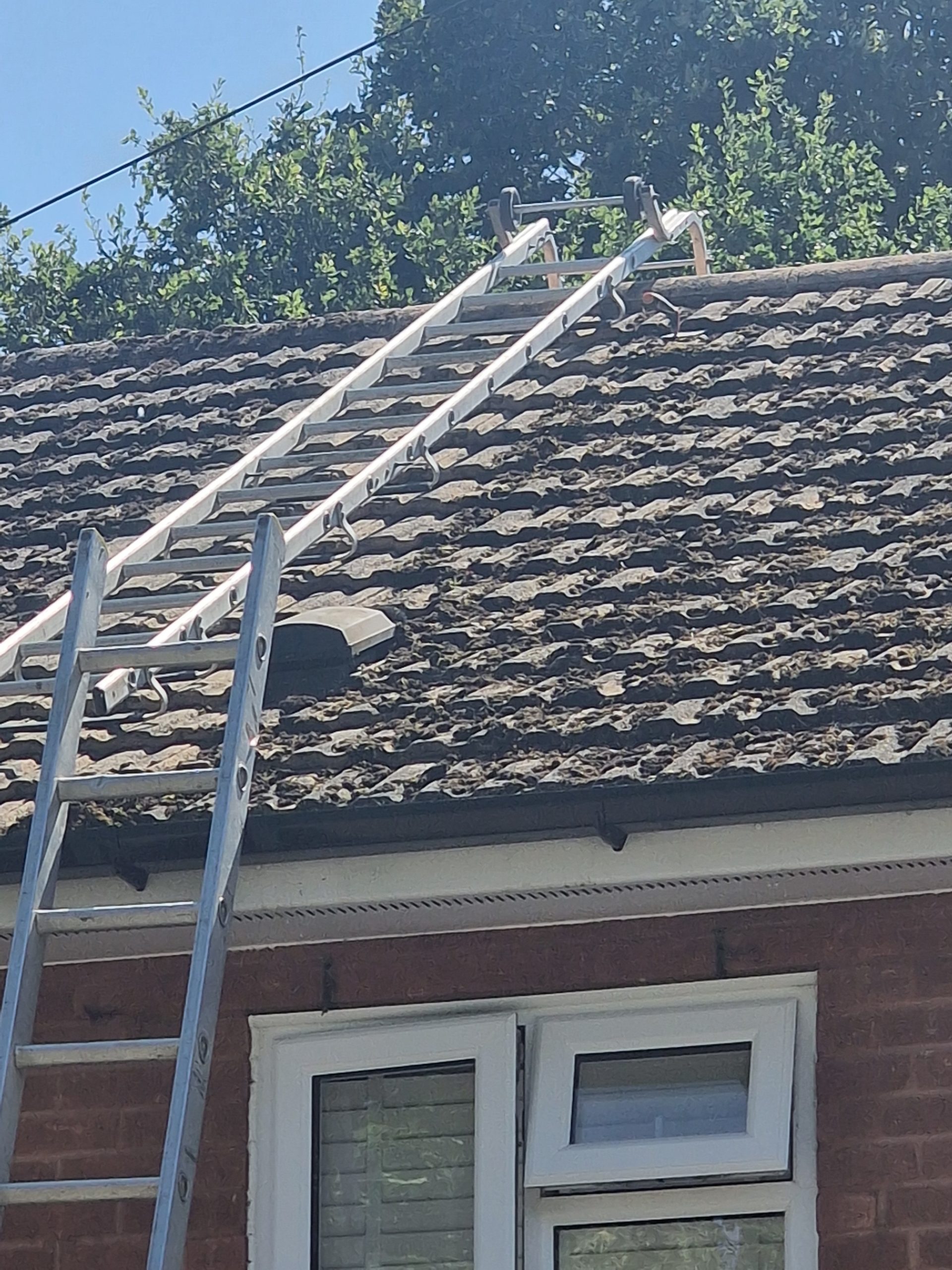 Gutter line and roof tiles of a brick house in Berkshire