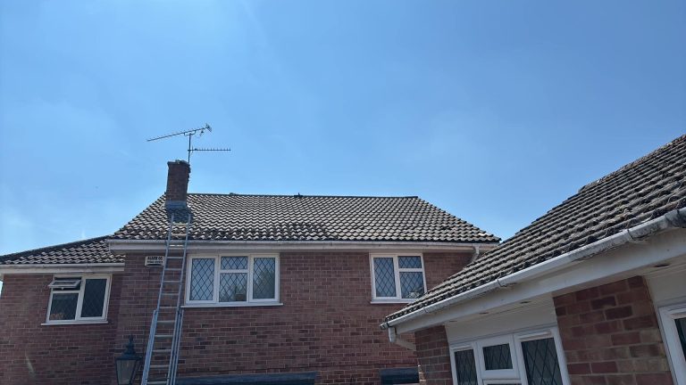 Ladder up to the gutters of a house in Andover