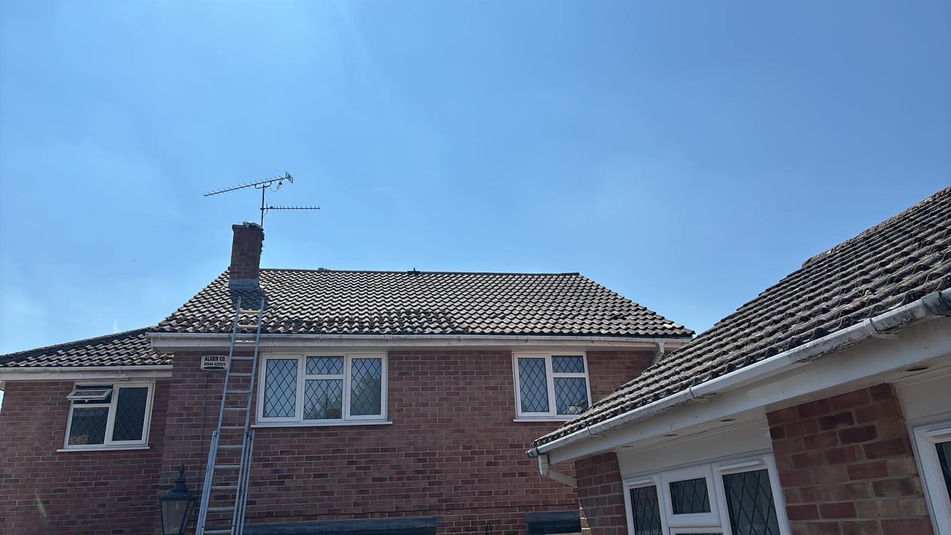 Ladder up to the gutters of a house in Andover, Hampshire
