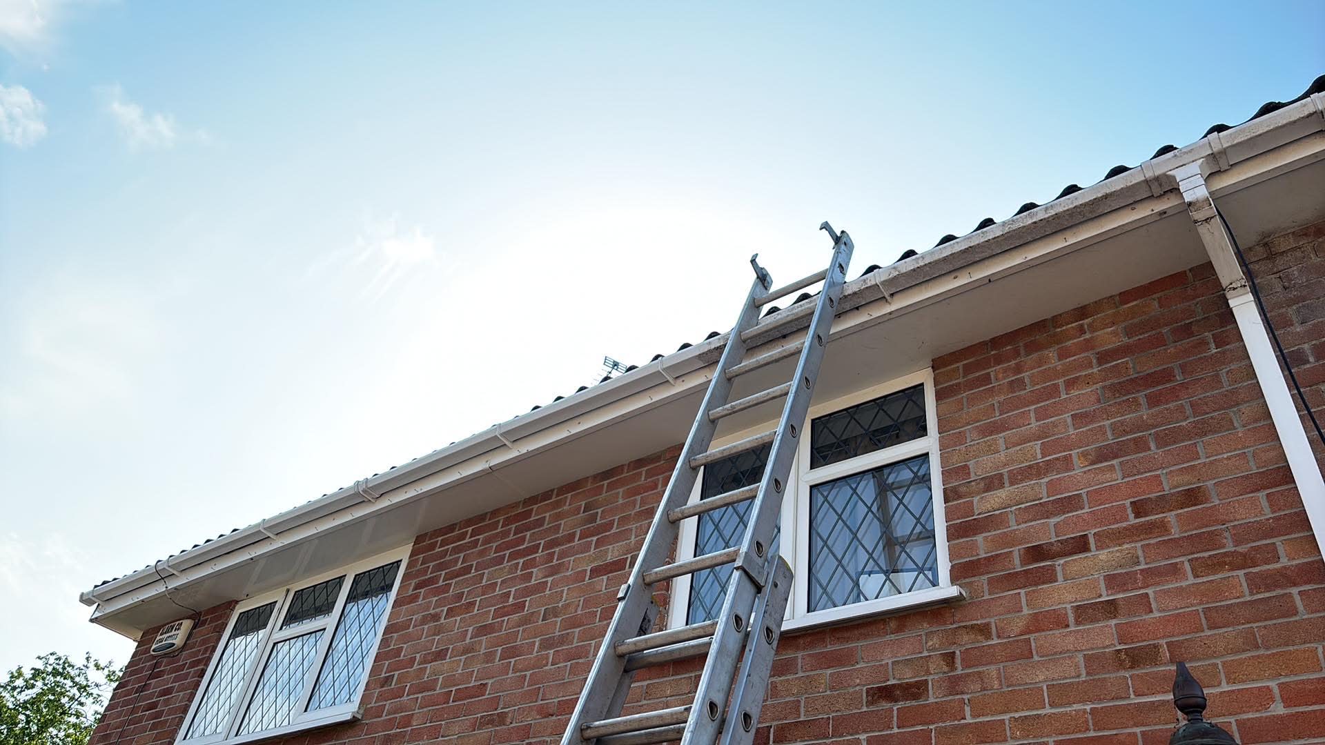 Gutter and downpipe on a brick house in Hampshire